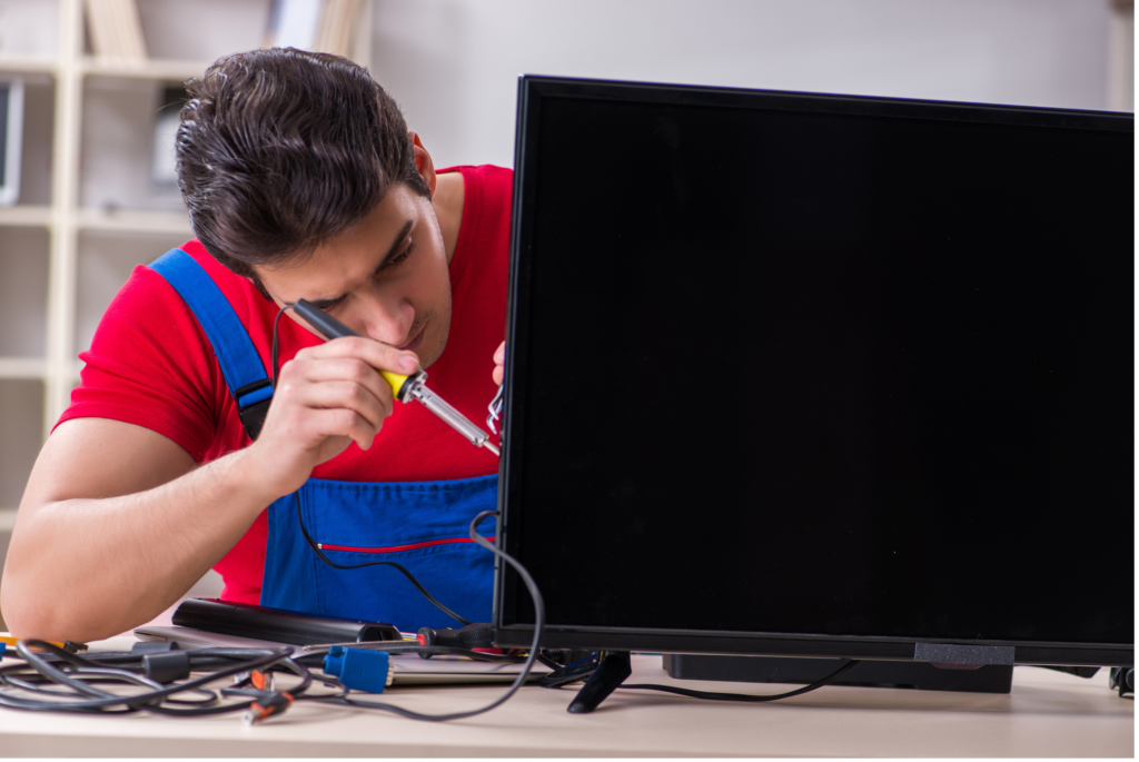 a tv techinician repairing the tv